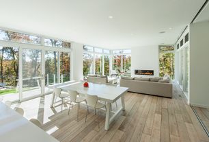 Contemporary Great Room with Regency Horizon HZ54E Large Gas Fireplace, Marvin Ultimate Awning, Hardwood floors