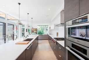 Modern Kitchen with Limestone counters, One-wall, Kitchen island, European Cabinets, Void Pendant Light, Undermount Sink