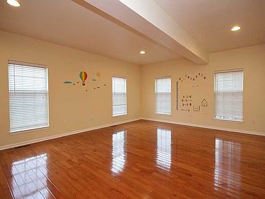 Diagonal Gray Blue Tiles Blue Walls And Crisp White Trim Define This Spacious Great Room With A Water View The Brighton I By Sout Home Blue Walls Great Rooms