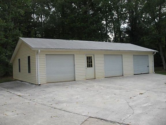 detached, 3 car garage w/power & water