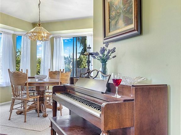 Notice the beautiful crown molding, this piano is available to stay with home!