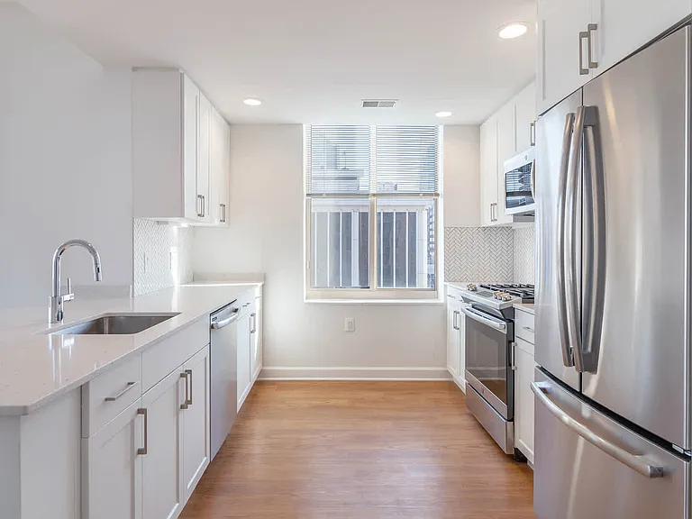 Kitchen with Gas Stove, Stainless Steel Appliances and Quartz Countertops