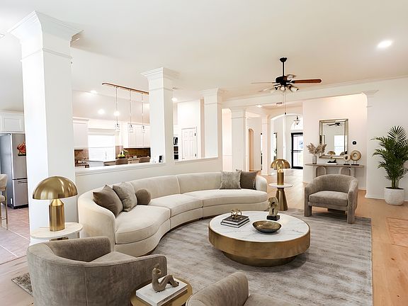 Seamless social hub; virtually staged to show the perfect transition from the Chef's kitchen to the Great Room.