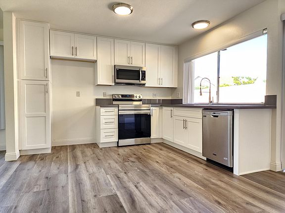 Remodeled Kitchen with new cabinets, new countertop, and new sink/faucet