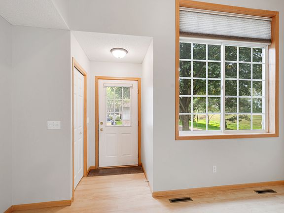 Entry with convenient coat closet and large living room window
