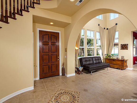 Inlaid tile, arched entry