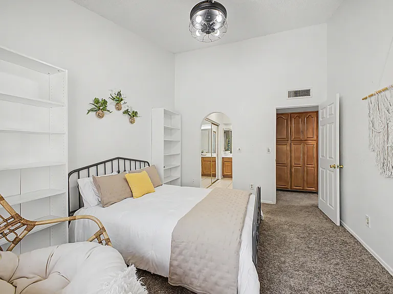 Primary Suite (Upstairs): Queen Bed, Dual-Sink En-Suite Bathroom, Multiple Closets, Pool Views, Sleeps 2