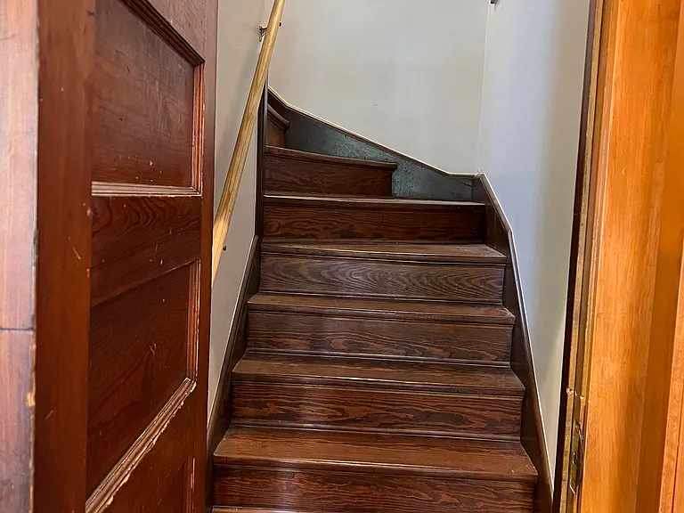 Locked key entry to staircase at the rear of property to 3rd floor residence.