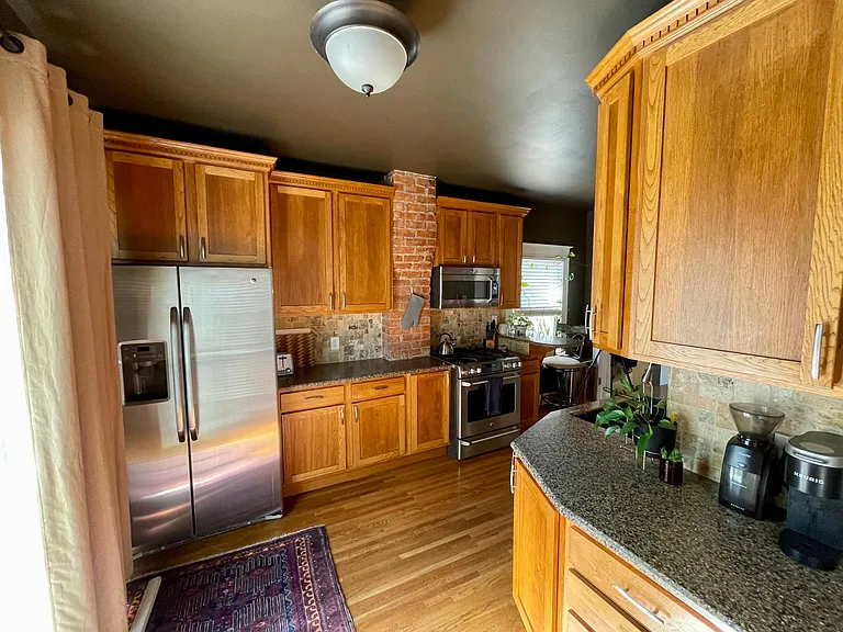 Kitchen with plenty of cabinets for storage - all appliances will stay with the property.