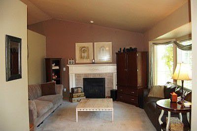 Airy Vaults and lovely colors greet you. Bay window in front with a gas fireplace too !