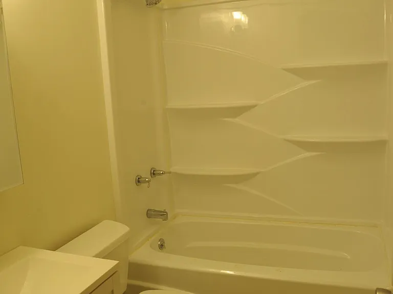 Bathroom with bath and shower