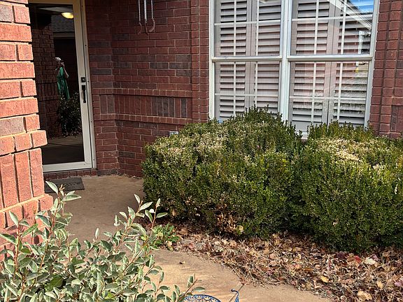 Front entryway and large windows in living room