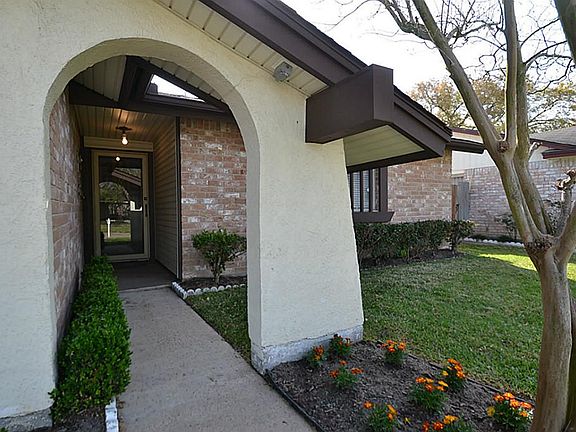 Arched front doorway inviting you inside.