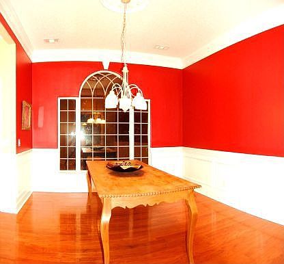 Formal dining room with 10" crown molding and wainscotting