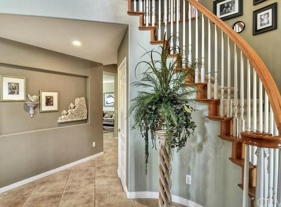 Foyer with two-tone spiral staircase