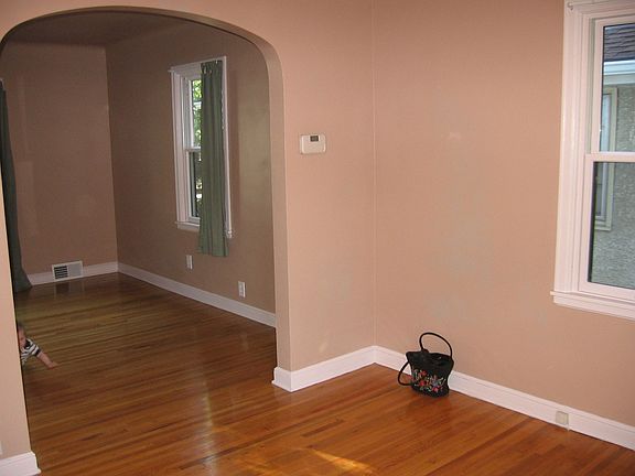 dining room with arch entrance to living room