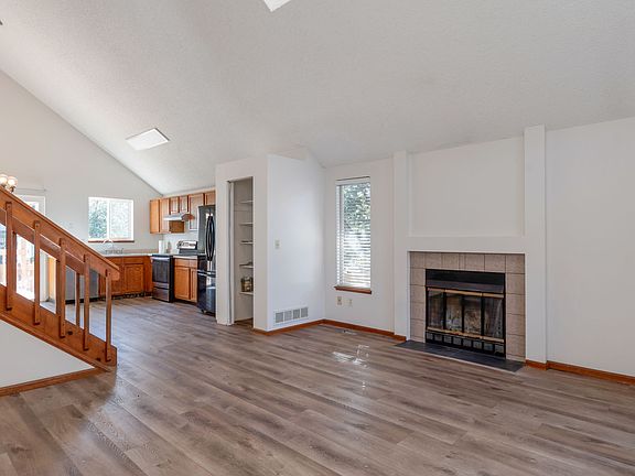 Light and bright living room with vaulted ceilings and skylight