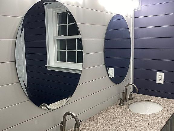 Hall bath with shiplap walls
