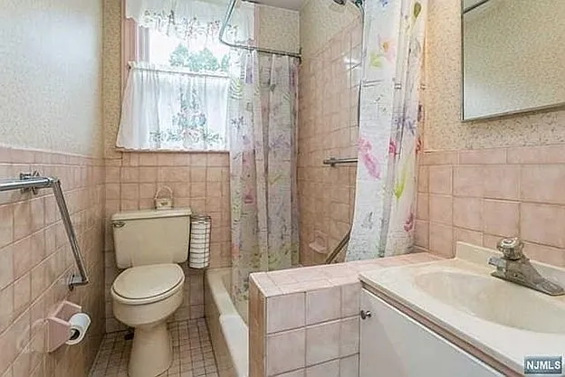 1st floor bath between kitchen and dining overlooking private fenced in area