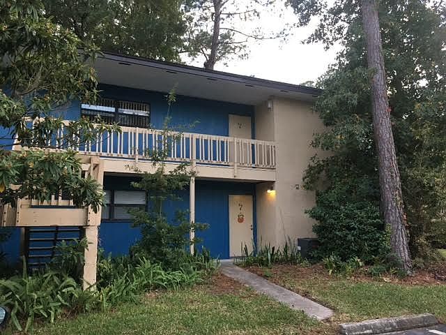 Entrance with wooded lot