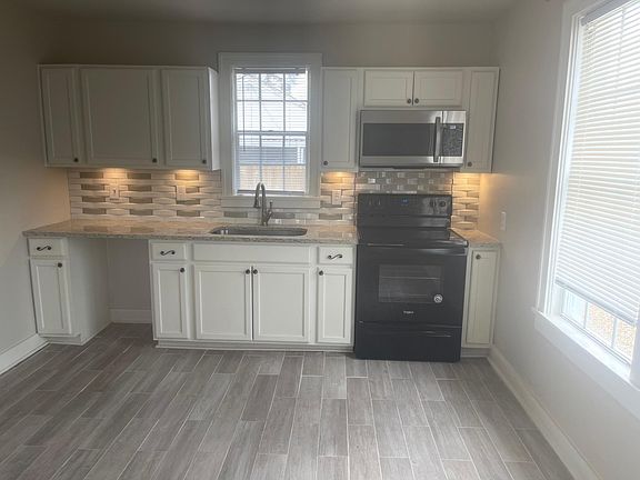 Dishwasher will be added. Refrigerator, range, and microwave provided.