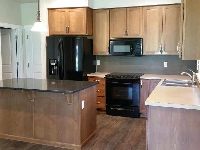 Kitchen with 42" Cabinetry. Lots of storage space with pantry closet off to the side.