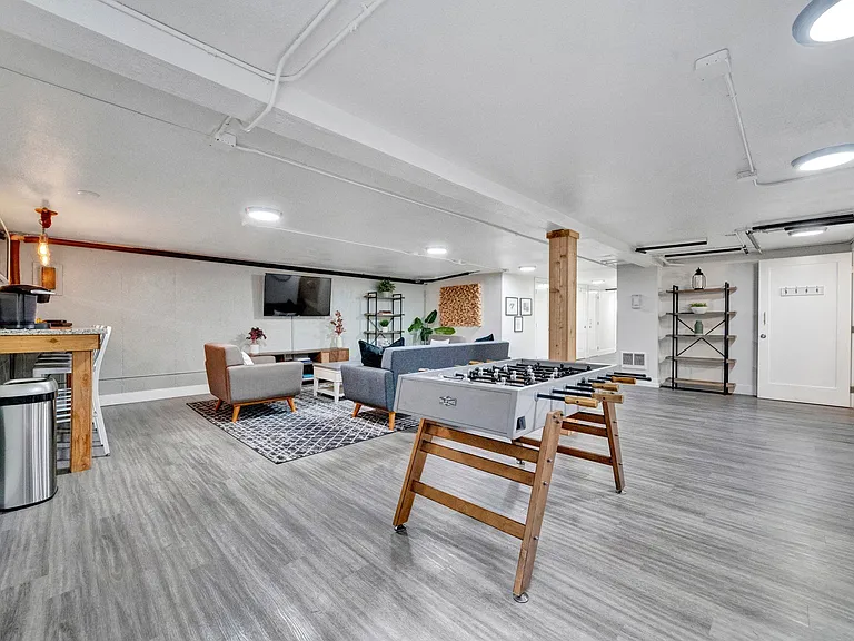 our apartments offer a living room with a fireplace and a flat screen tv Sunset Station Apartments Portland Oregon