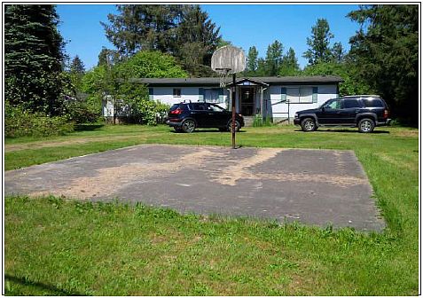 Front yard/ Basketball court