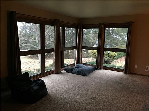 LIVING ROOM WITH MULTIPLE  NEW WINDOWS TO APPRECIATE THE VIEWS!