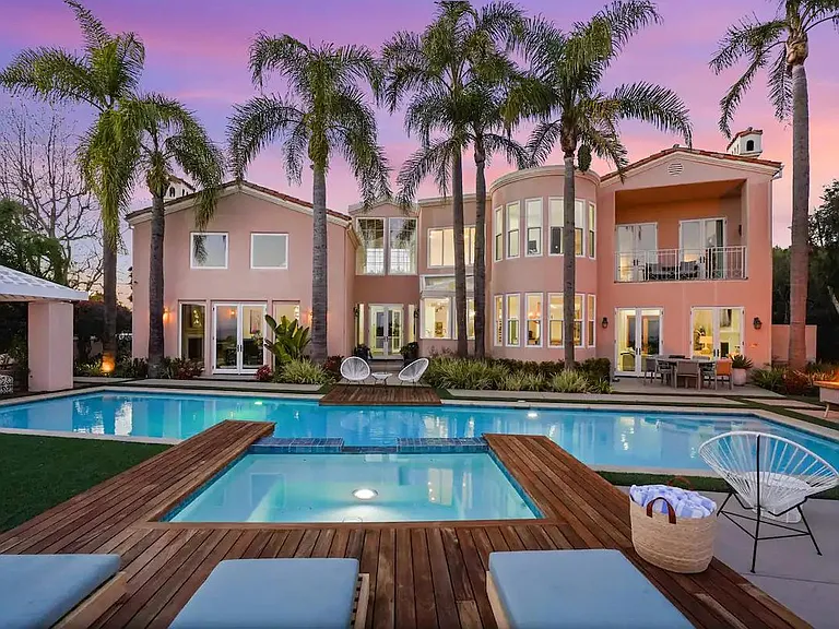 Unwind by the poolside as the sun sets in spectacular hues.