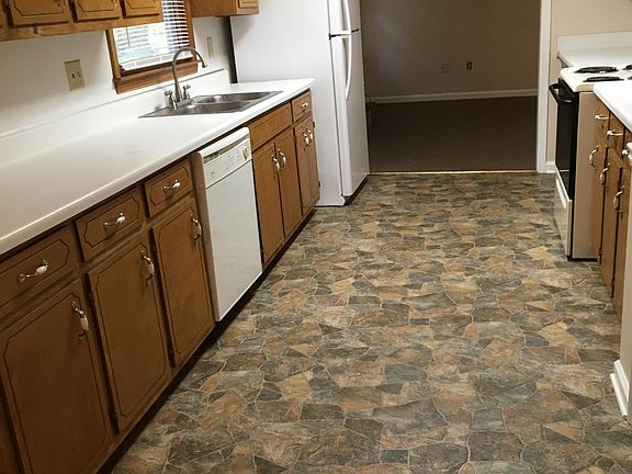 Kitchen left side, w/dishwasher, double sink, new faucet, fridge w/ ice maker.