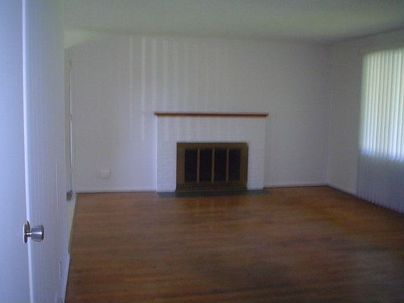 Living room with wood burning fieplace.