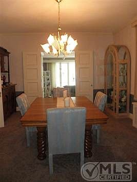 Formal diningroom opens to library/familyroom, front hall and kitchen