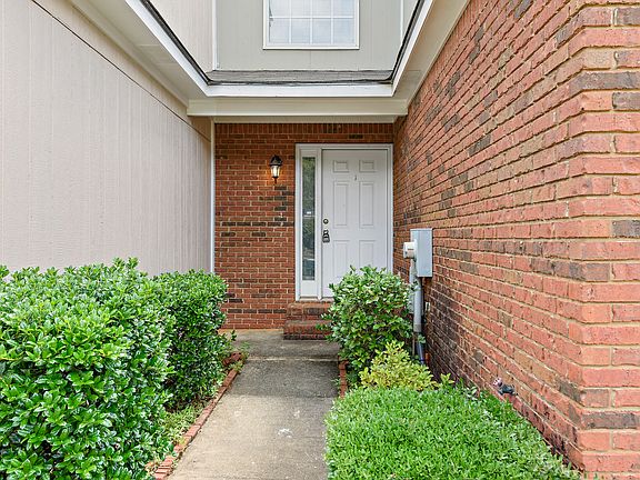 Welcoming front door with beautiful landscaping