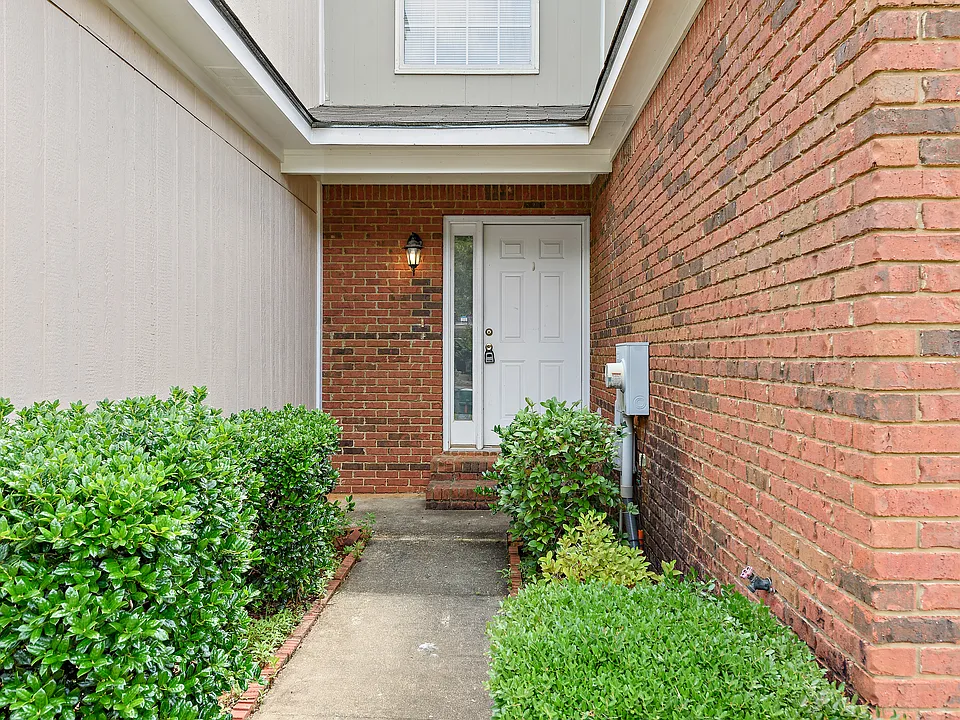 Welcoming front door with beautiful landscaping