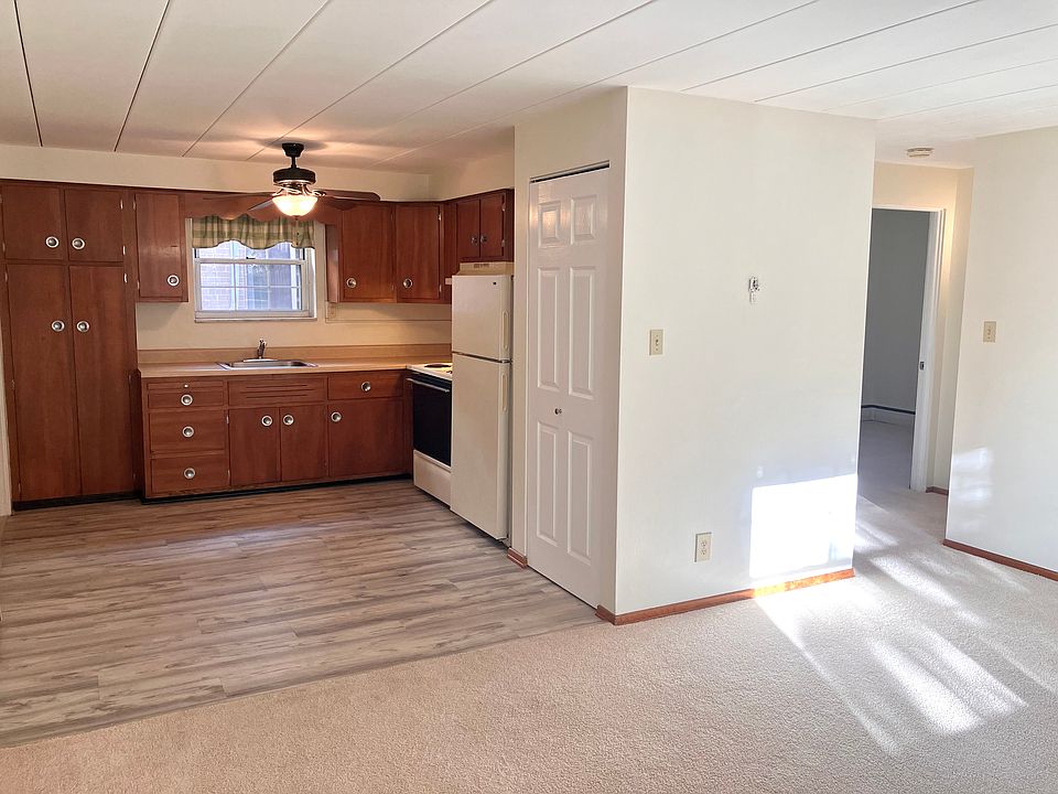 standing in living room, looking to kitchen
