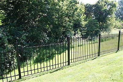Gated community with wrought iron fencing behind you.