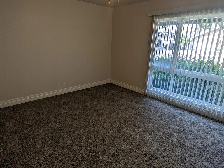 Primary suite located downstairs with new carpet and paint