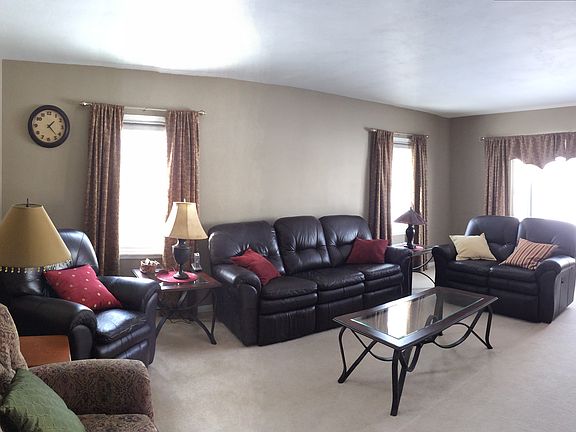 Bright large living room with newer carpet