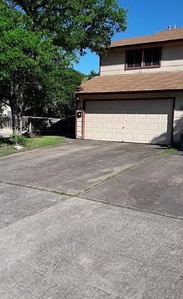 Two car driveway and two car garage with garage opener.