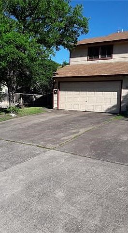 Two car driveway and two car garage with garage opener.