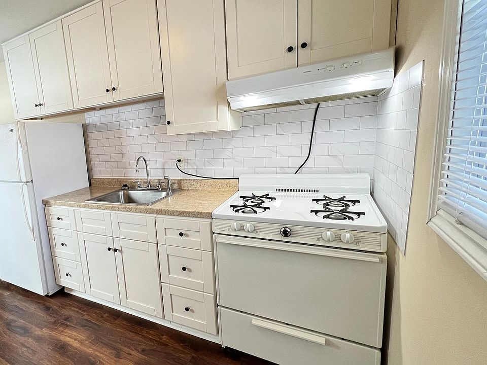 Bright Kitchen, with white appliances and lots of storage