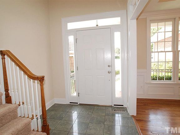 2-Story Foyer with Double Foyer Lighting, Porcelain Tile Flooring, Double Doors to Family Room & Tra