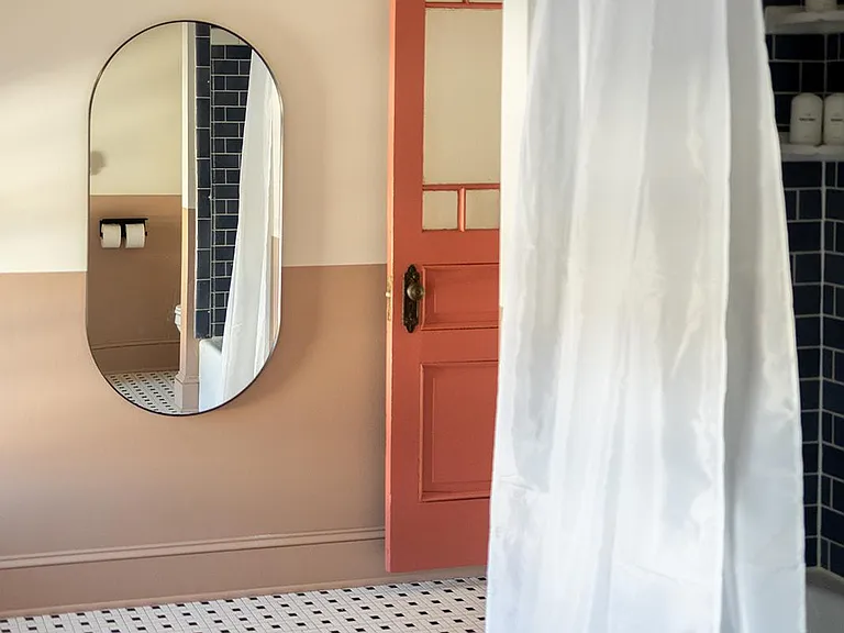 Another perspective of the spacious bathroom. ___ This room is designed for your comfort and relaxation, with all the amenities you need to unwind. Soak in the tranquility and get ready to rejuvenate. _______