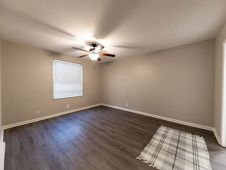 Experience comfort in this spacious bedroom, perfect for relaxation.