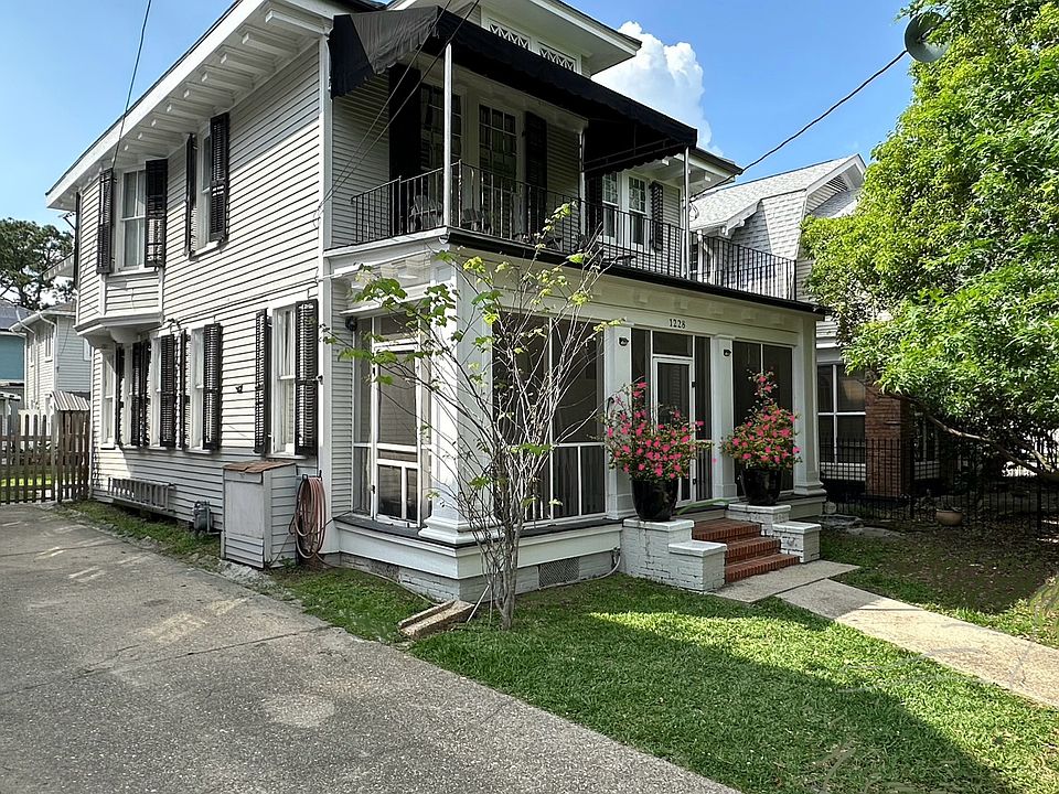 Screened porch to make it a livable area to watch pedestrians on the sidewalk.