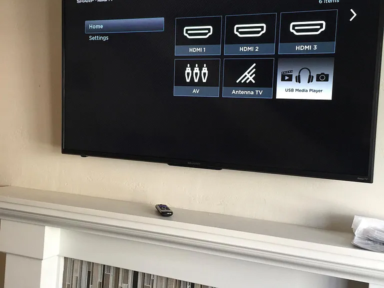 Wall mounted TV over fireplace