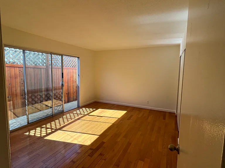 Bedroom with enclosed sideyard