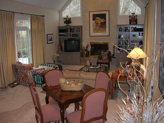Family room with fireplace and built-in cabinetry.