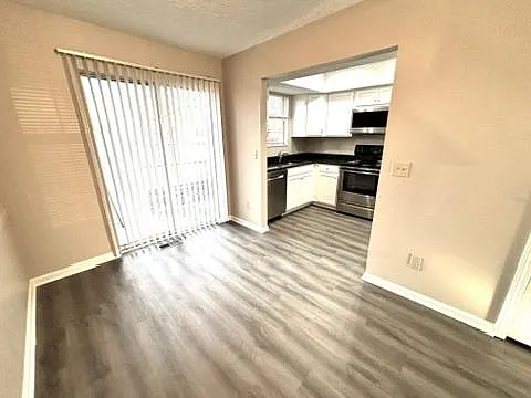 Eating area with view of patio slider door and kitchen